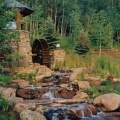 This water in this cascading stream is created solely from the melting snow in the Rocky Mountains at 12,000 feet. The melting water drives a water wheel and then flows through two trout ponds before turning back into a mountain stream.