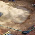 The concrete support slab is seen under the liner before and after the installation of the rebar.