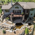 The drone was roughly 50 feet off the ground and over the hillside to be able to grab a shot of the whole backside of the landscape and house.