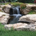 Beautiful, weathered limestone was used for this pond-free feature. Only six large stones make up the fall and stream.