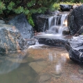 1,500 lb rocks are used on a 10-foot by 10-foot pond.