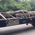 Weathered Pennsylvania fieldstone is delivered on massive trucks.