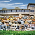 The pond design really frames the beautiful architecture and greenery at the golf club.