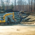 These photos are from a swimming pond in Connecticut. The underliner drain lines get installed in the swimming pond prior to the underlayment and pond liner being installed.