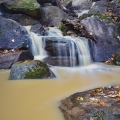 The winner of the best Pondless water feature design includes 2 ton boulders with this residential beauty.