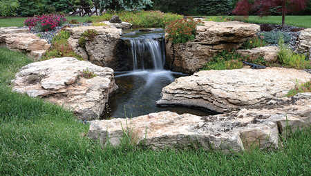 Beautiful, weathered limestone was used for this pond-free feature. Only six large stones make up the fall and stream. 