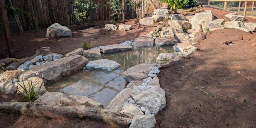 zoo habitat with stream