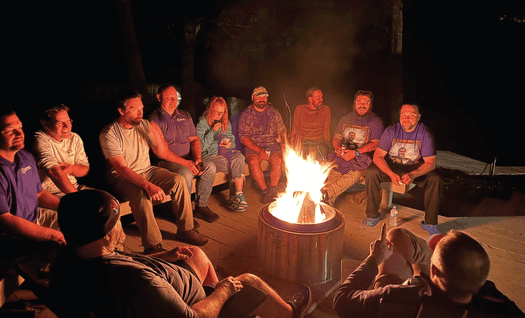 PPA members gather around a campfire.